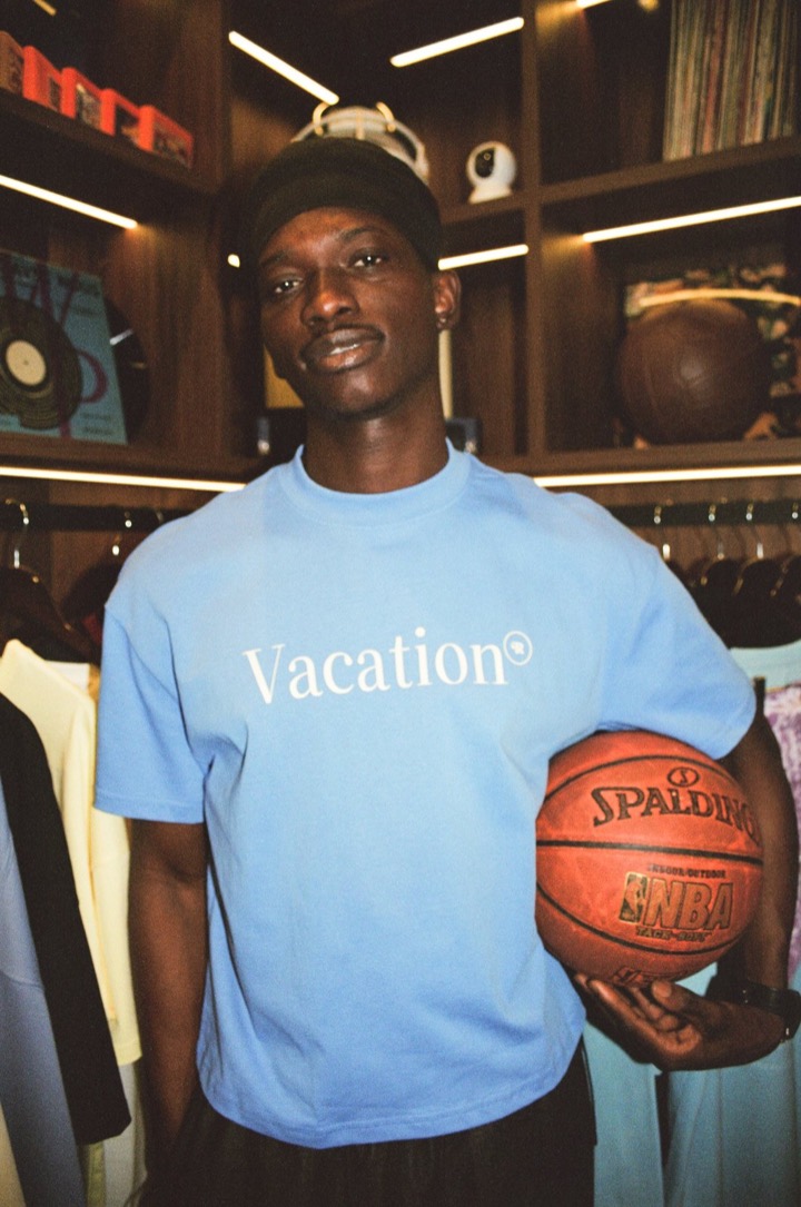 Deji in a light-blue tee with a basketball